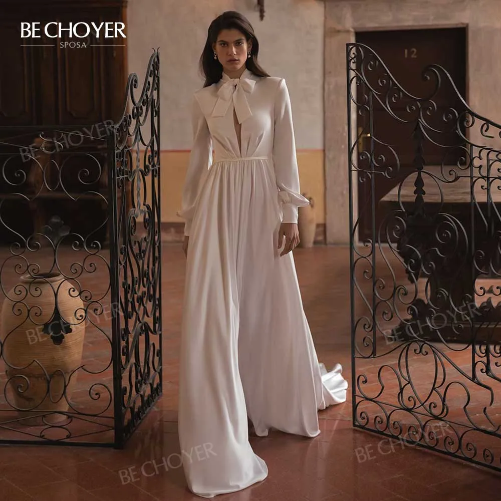 

Платье Свадебное ТРАПЕЦИЕВИДНОЕ атласное с длинным рукавом, бантом и шлейфом