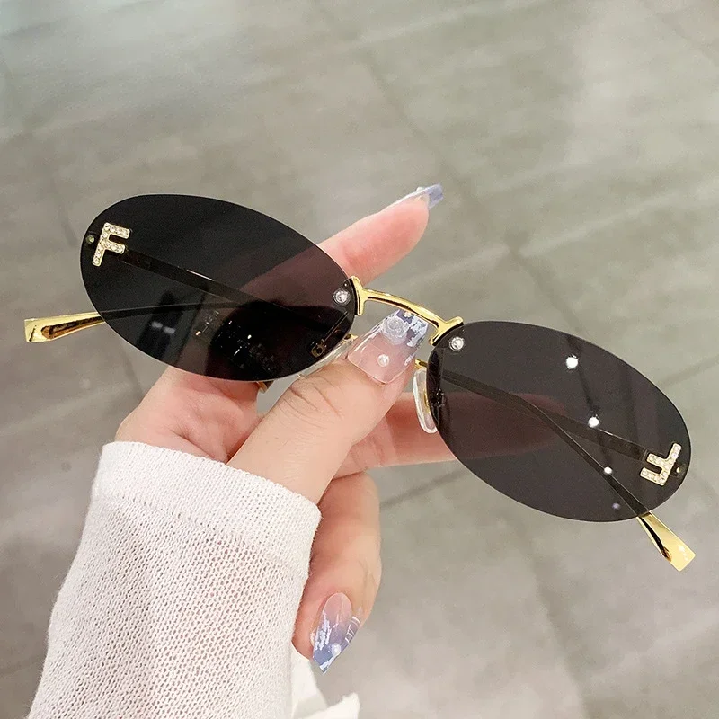 

2023 Cat Eye Sun Glasses Female Outdoor Shopping Shades Rimless Driving Eyewear Glasses Retro Letter Oval Sun Glasses Shades
