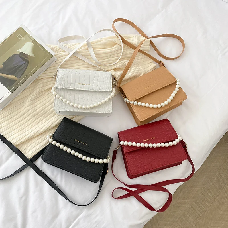 Foreign style pearl handbag women's 2022 spring and summer new fashion temperament simple single Shoulder Messenger Bag