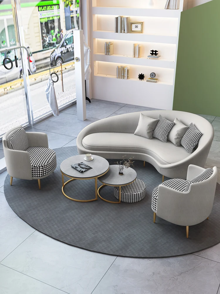 

Nordic modern simple beauty salon hotel lobby shop reception light luxury arc shaped sofa, tables and chairs in the rest area