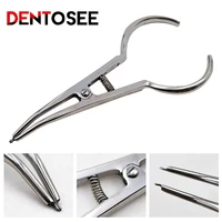 dental ring placed pliers dental tools arranged for separator circle pliers elastic ligature ties rubber clamp forceps
