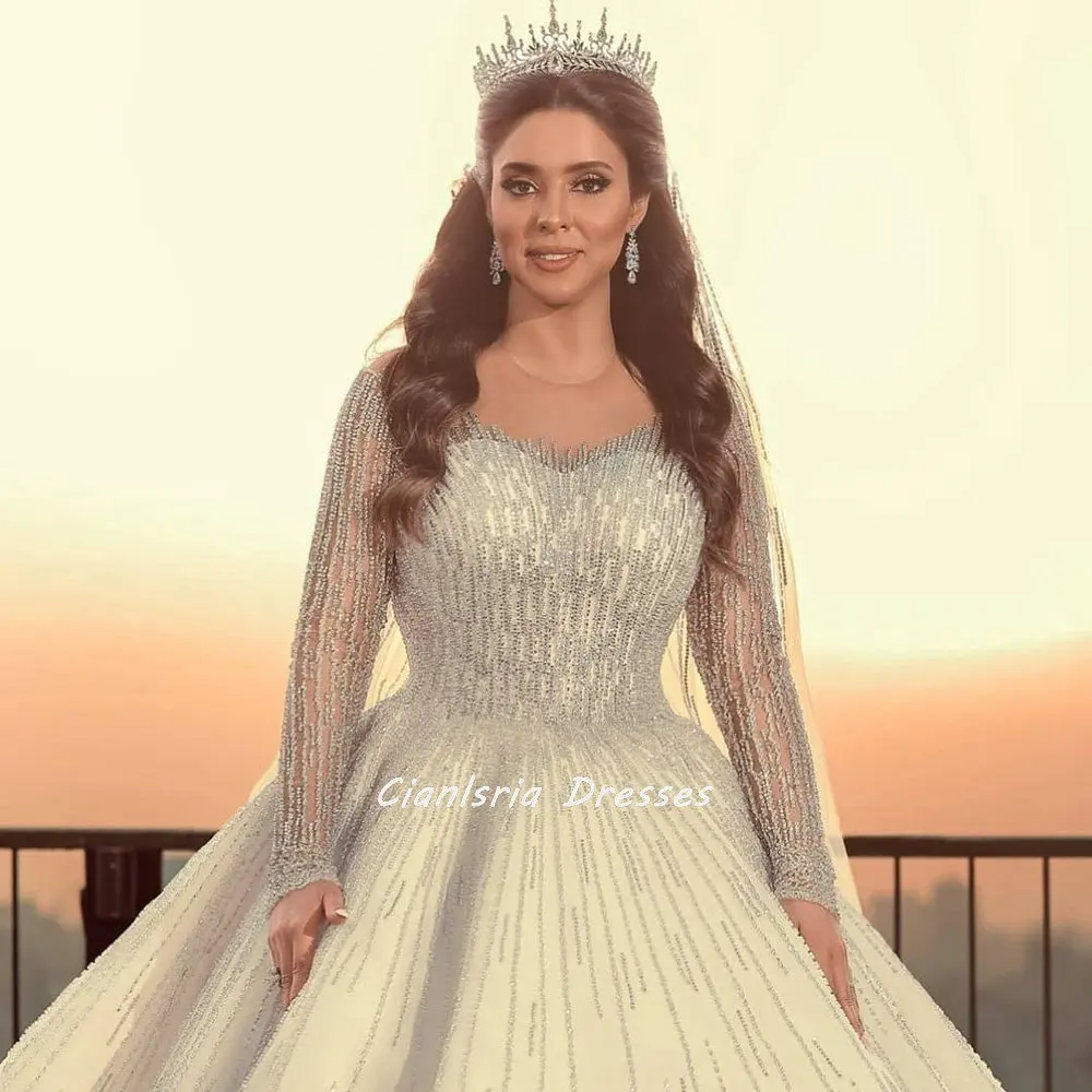 

Luxurious Cathedral Train Beading Crystal Dubai Wedding Dresses Ball Gown Illusion Long Sleeve Saudi Arabic Bridal Gowns