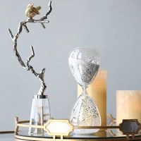 gold bird standing on a silver metal aluminum branch statue home decor living room crystal glass ornament crafts animal figurine