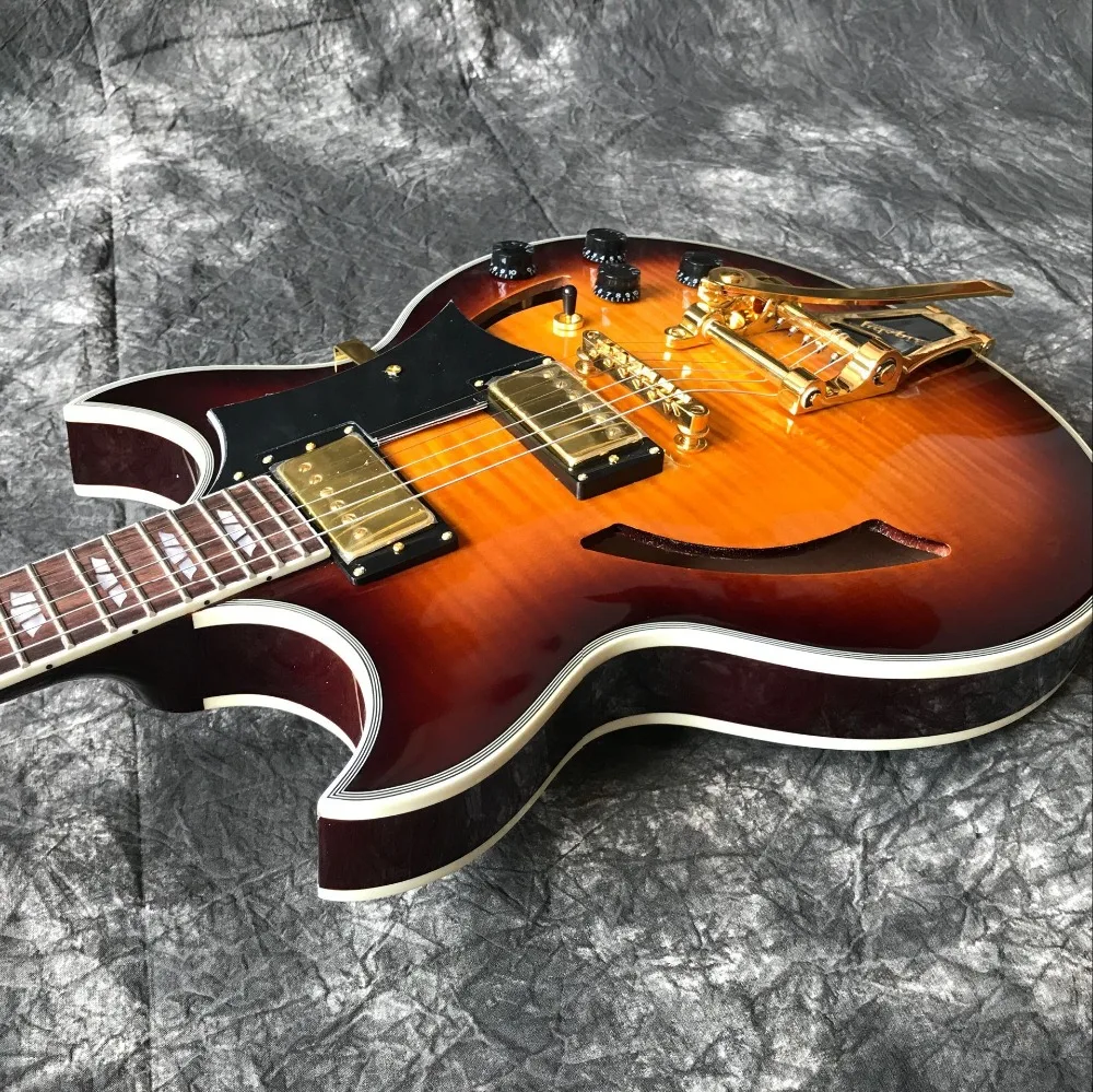 

custom shop.semi hollow body jazz Electric Guitar 6 Strings.Tiger Flame Sunburst guitarra and Gold hardware.vibrato system