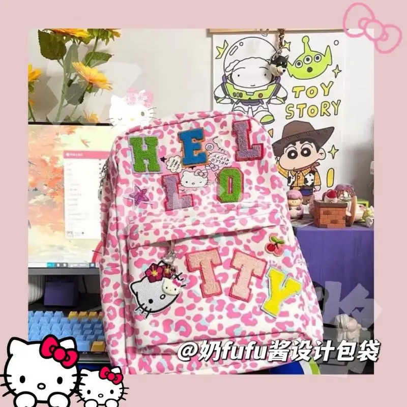 

Новый милый рюкзак Sanrio Kawaii, рюкзак с леопардовым принтом Hello Kitty, школьный ранец большой вместимости, милый подарок для девочки, рождественск...