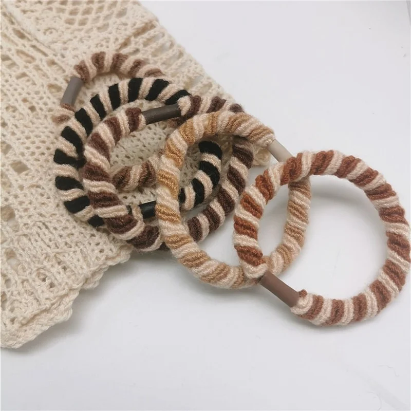 

Korean version of ~ Purchasing retro temperament handmade three-color twist braided hair rope wild basic rubber band jewelry