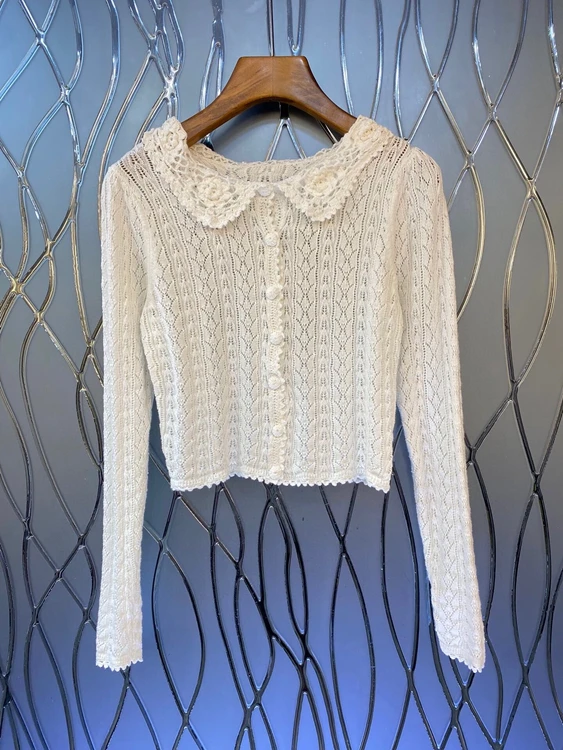 

Женский трикотажный топ на пуговицах с длинным рукавом