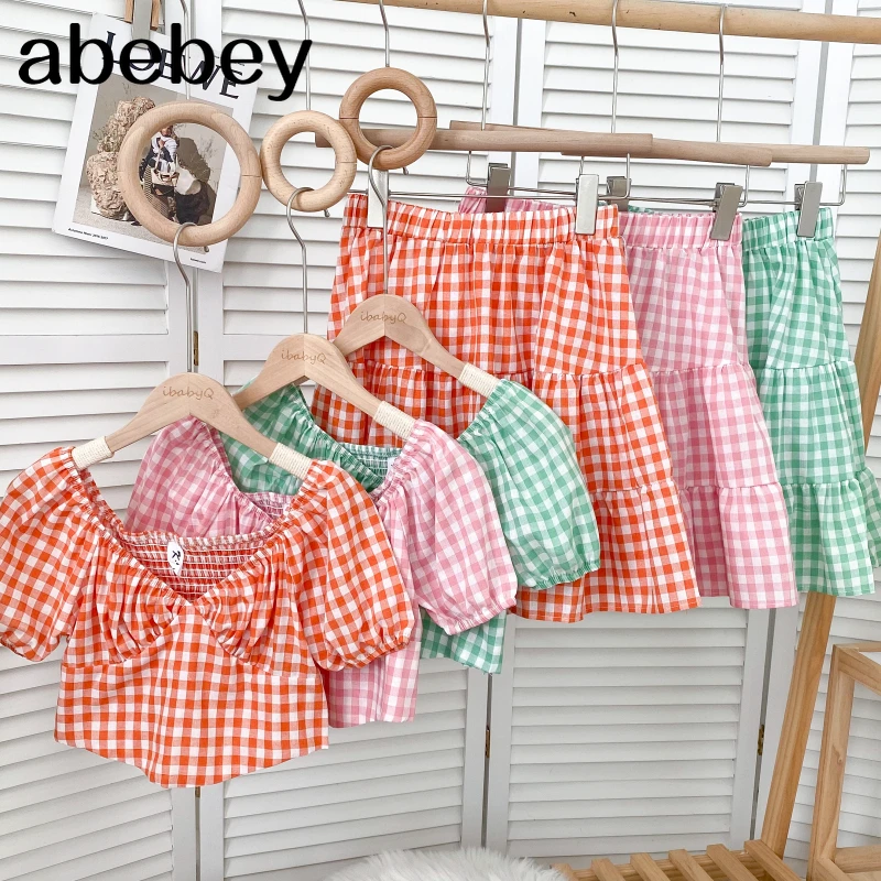 

Sweet V-neck short sleeve irregular short plaid Shirt Top + Ruffles high waist short Skirt two-piece set 2022 New Spring Autumn