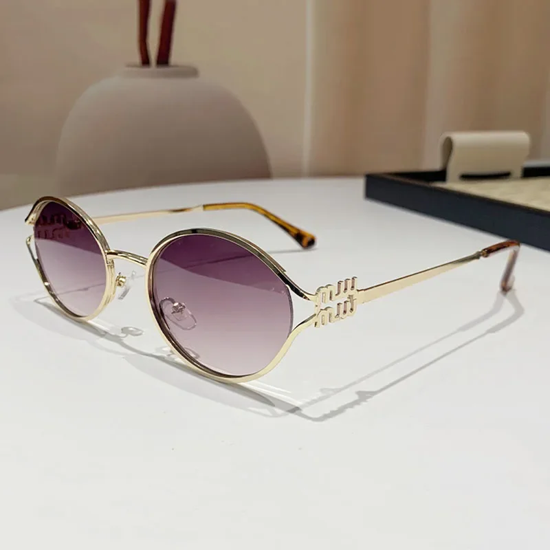 Очки солнцезащитные женские в овальной оправе из сплава