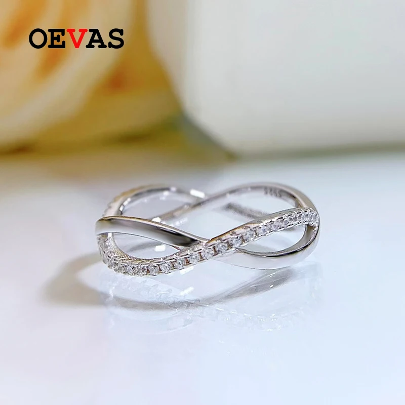 

OEVAS 100% Серебро 925 пробы высокоуглеродистые бриллиантовые перекрещивающиеся кольца с бантом для женщин сверкающие ювелирные изделия для сва...