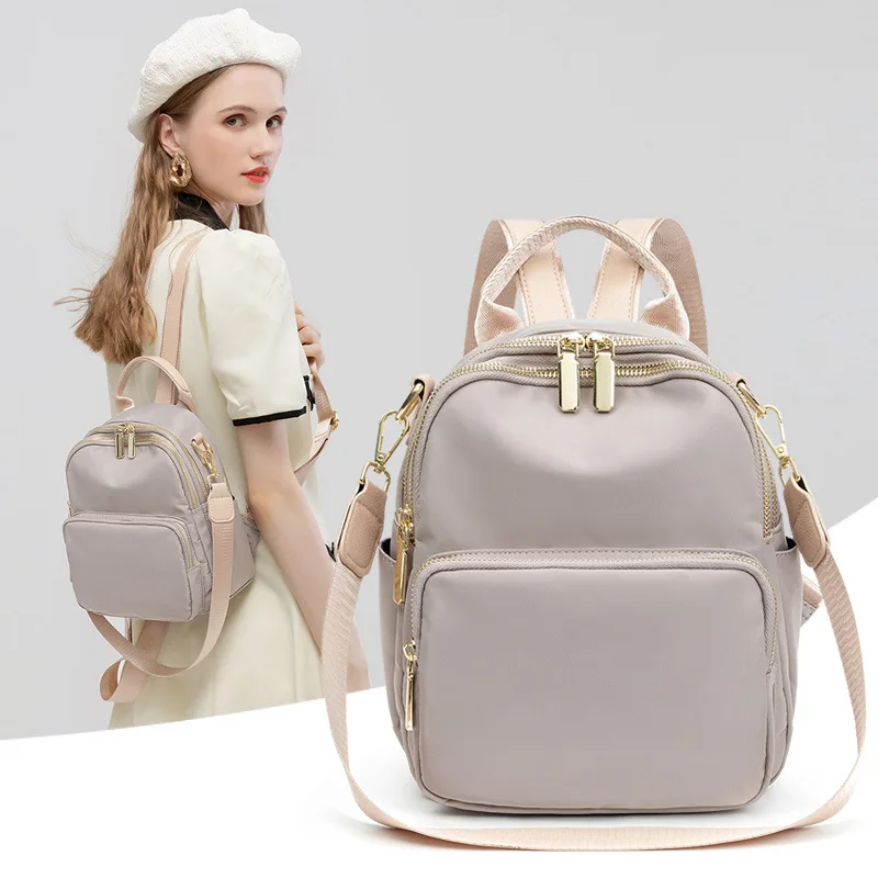 

Повседневный универсальный рюкзак из ткани Оксфорд Корейская версия модный однотонный вместительный водонепроницаемый рюкзак