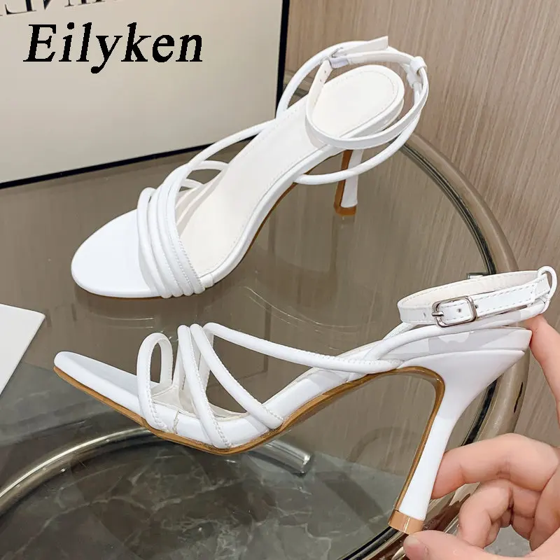 

Eilyken/Новые летние женские босоножки на тонком высоком каблуке с узкими лентами; Пикантные женские платье для банкета, вечеринки с открытым носком; Zapatos De Mujer