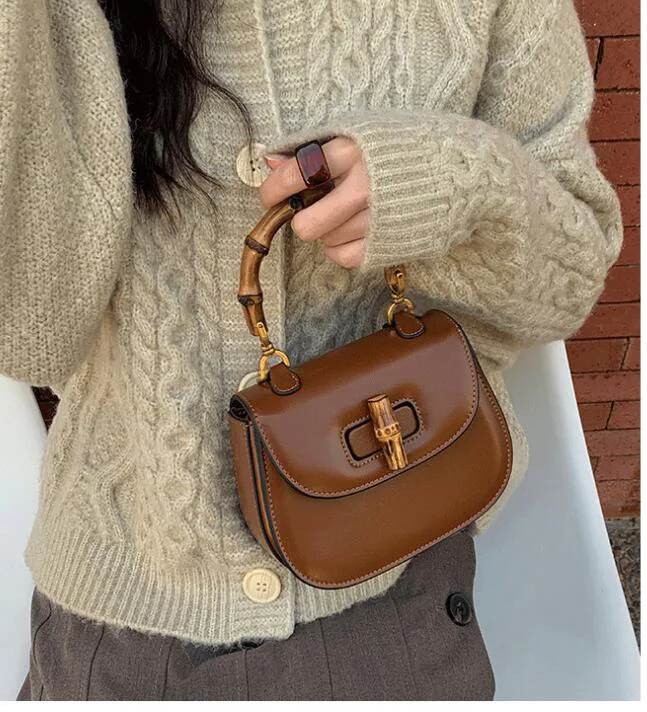 2023 new women's bags trendy fashion handbag shoulder cross bag bamboo section lock retro saddlebag niche bag