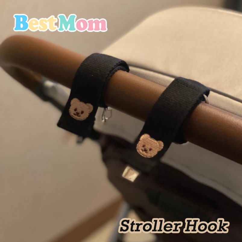 

2pcs/Set 2023 Baby Stuff Cartoon Stroller Hook Strong Solid Multi-Functional Cartoon Pannier Bag Stroller Accessory