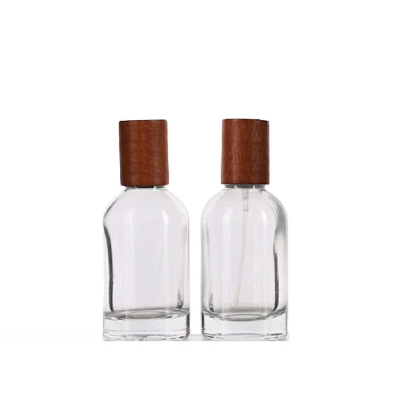 

Wooden Lid Crimp Lid Pump Clear Thick Bottom Glass Refill Vials 30ml 50ml 100ml Empty Round Glass Perfume Spray Bottle 5pcs