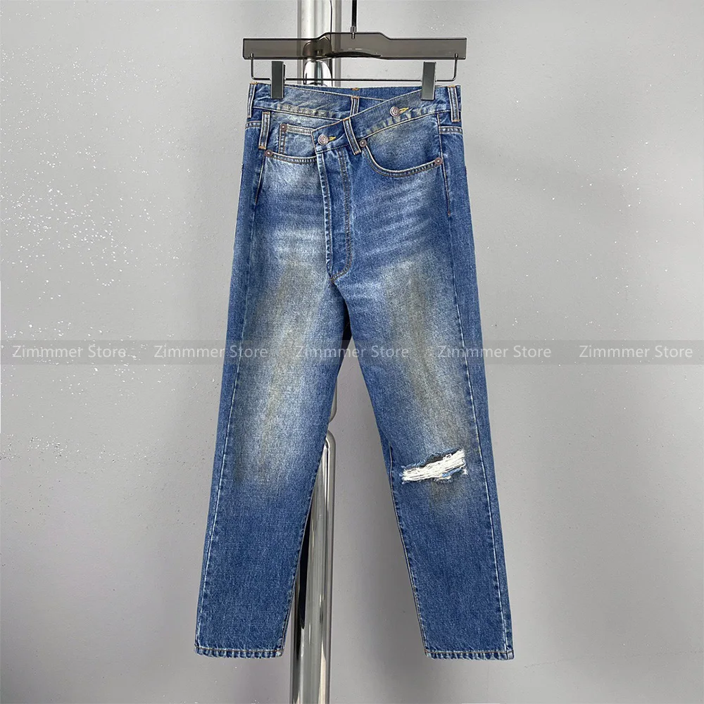 

Blue asymmetric broken holes jeans female 2023 autumn and winter new dirty colour stains do old tapered nine-minute jeans