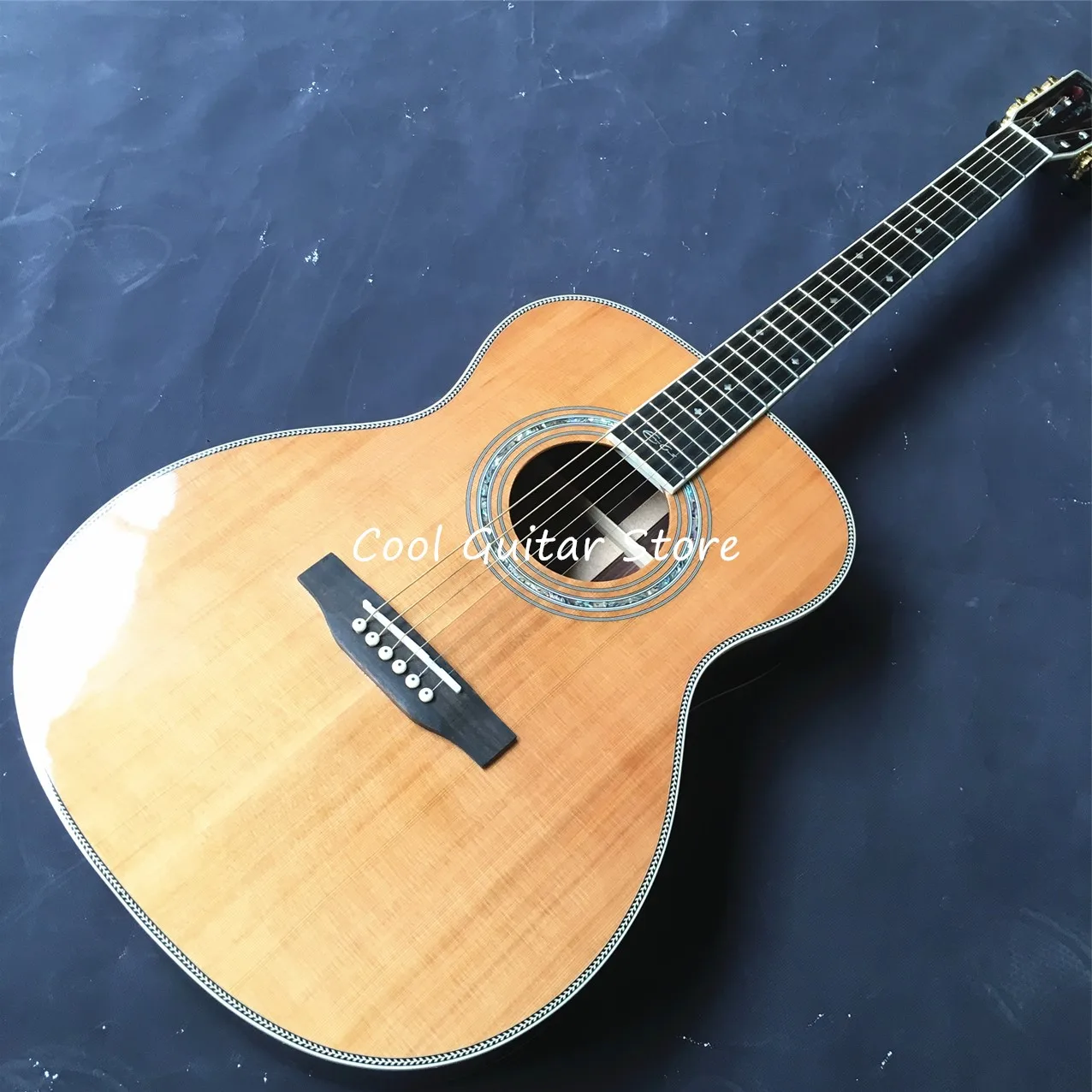

Solid Cedar Top OM Style Acoustic Guitar,Fishbone Binding,Classical Shape Headstock,Ebony Fretboard,39 Inches,Free Shipping
