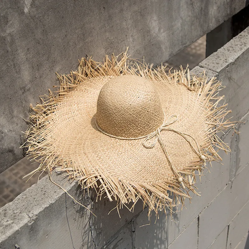 

Ins trend tassel raffia hat Wide brim Ribbon sun protecion hat Summer Breathable Beach cap Straw hat for women ladies