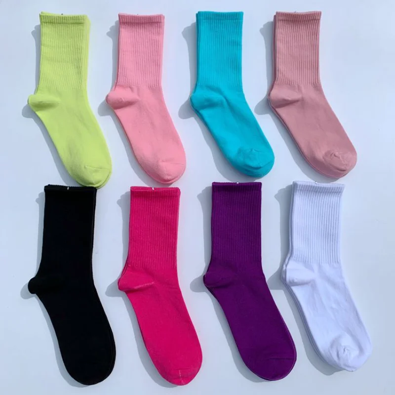 

Solid color men's and women's mid-tube socks European and American street skateboarding day department of preppy stockings