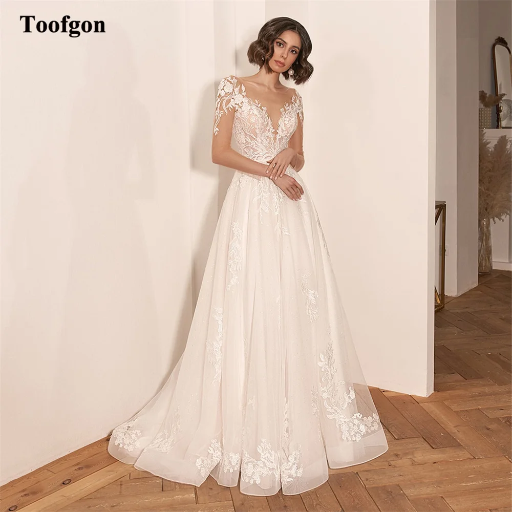 

Toofgon Shiny Tulle Nude Long Sleeves Formal Wedding Dresses Bride Appliques Lace Buttons Women Boho Bridal Gowns Party Dress