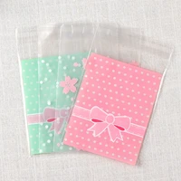 100pcs transparent opp plastic package lovely bowknot self adhesive bags bracelets earrings necklace gift bags jewelry diy 7x7cm