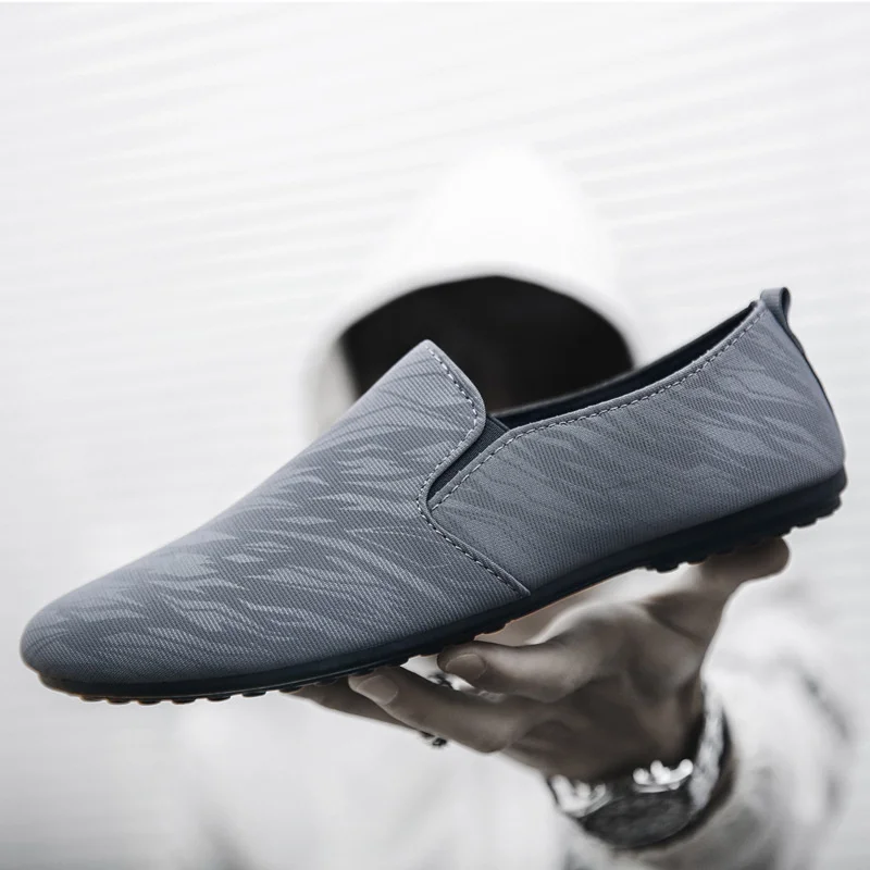 

2023 Men Flat Casual Loafers Trend Slip on Sport Shoes Fashion Light Breathable Solid Color Walking Shoes patillas Hombre