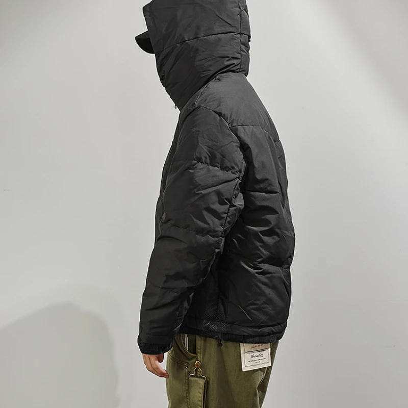 Hooded down jacket men's fake two pieces of loose shoulder sleeves in winter, the new warm outer wear black stitching jacket.