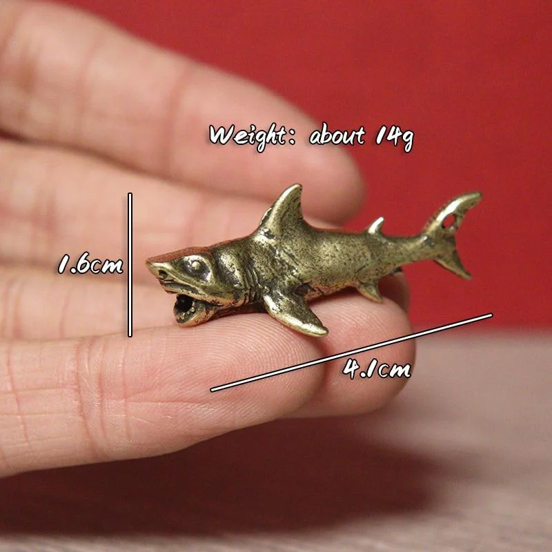 

Медные фигурки акул