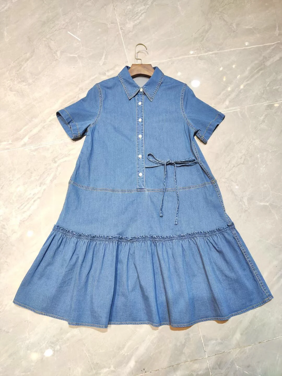 

Ruffled dress with pleated hem adds girly feeling, playful and age-reducing