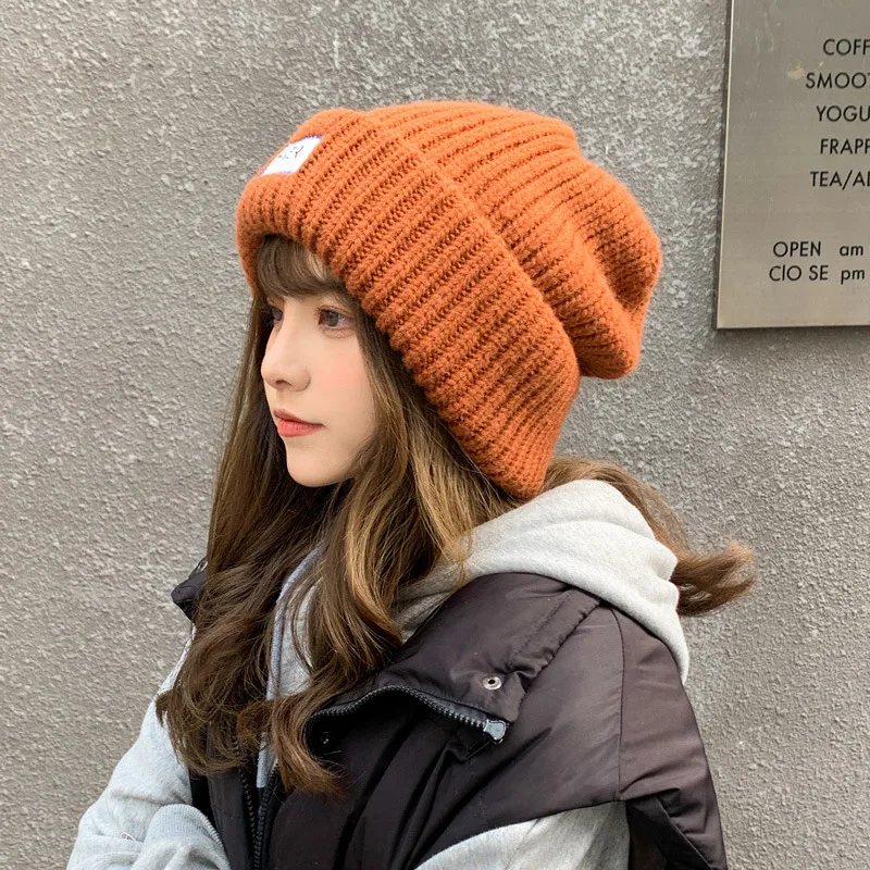 

Японская шерстяная шапка для женщин на осень и зиму, подходящая ко всему Корейская модель, наушники, большая свободная шапка с ворсом