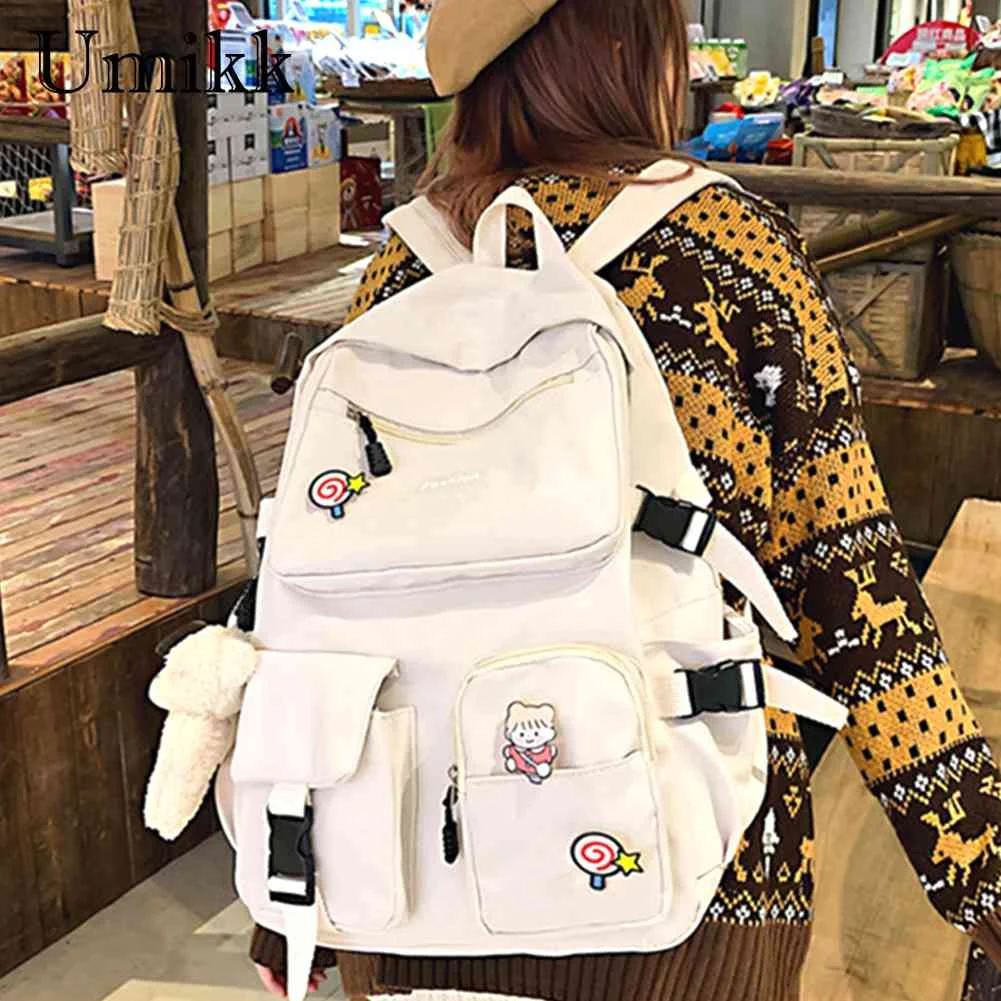 

2023 New Women Backpack with Dolls Pendant Zipper Outdoor Knapsack Large Capacity Fashion Solid Color Waterproof Ladies Backpack