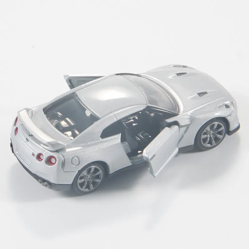 Фото Оригинальная модель автомобиля TAKARA TOMY Tomica Premium №17 Nissan GT-R 1/62 из литого сплава с открывающимися дверями и рабочей подвеской, коллекционная. №4