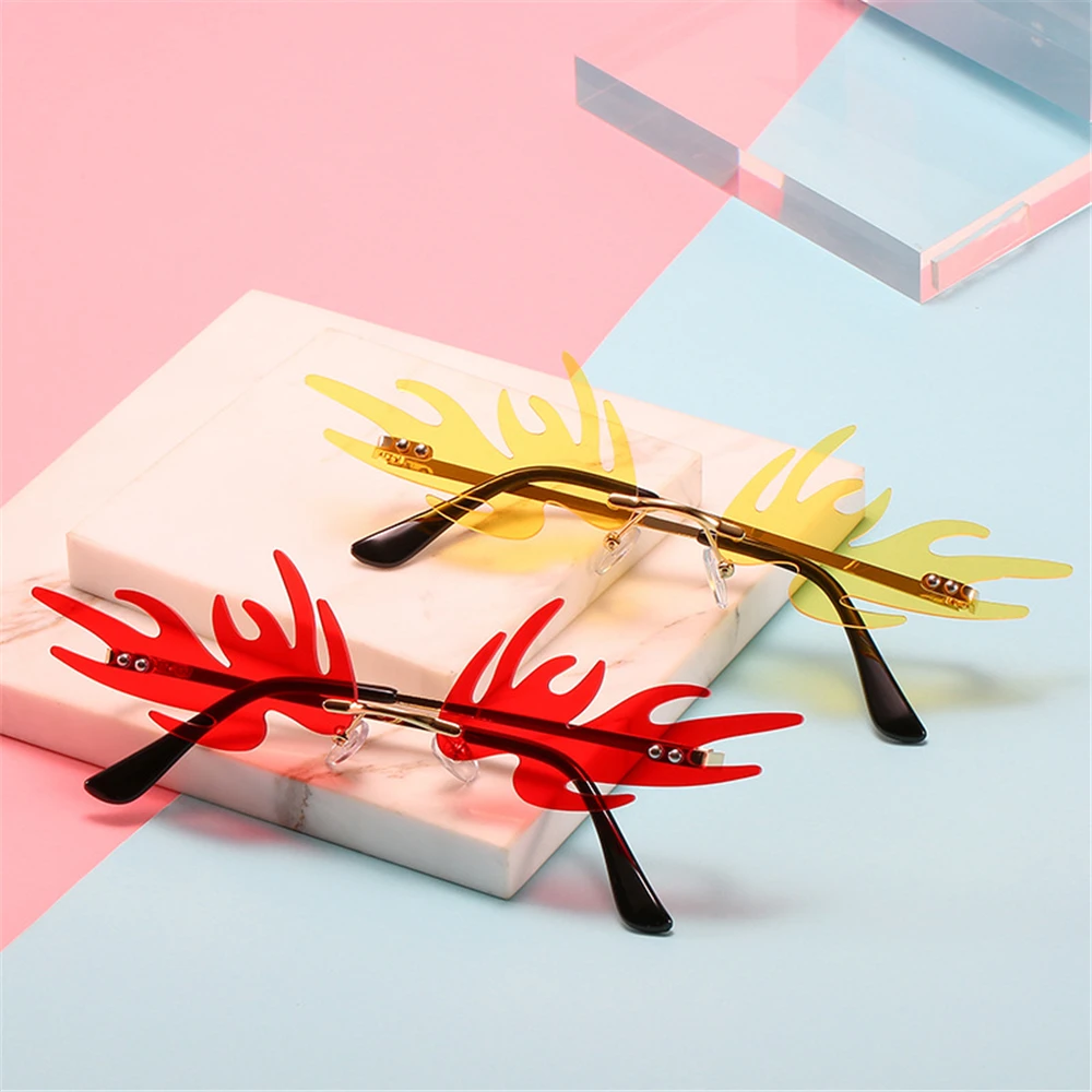 

Novelty Angel Wings Shape Sunglasses New Rimless Flame Sunglasses Metal Frame Sun Glasses Funny Party Cosplay Eyewear