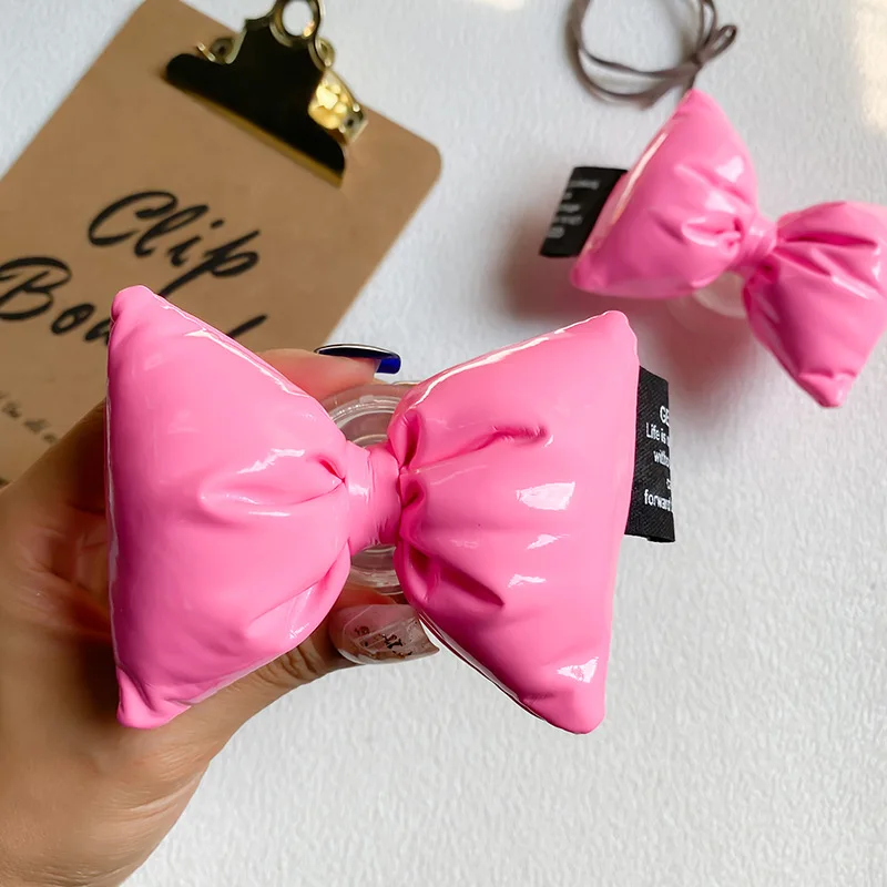 

Oversized Pink Bow Ties Phone Grip Holder Bowties Mobile Kickstand Cellphone Ribbon Foldable Stand Griptok for the Back of Phone