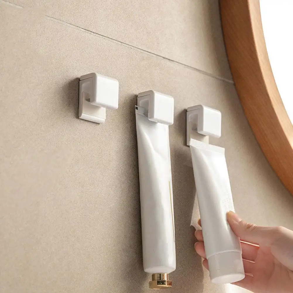 

Powerful Adhesive Seamless Bathroom Hanging Hook Clip For Facial Cleanser Toothpaste Towel Keys Home Kitchen Bathroom Organizer