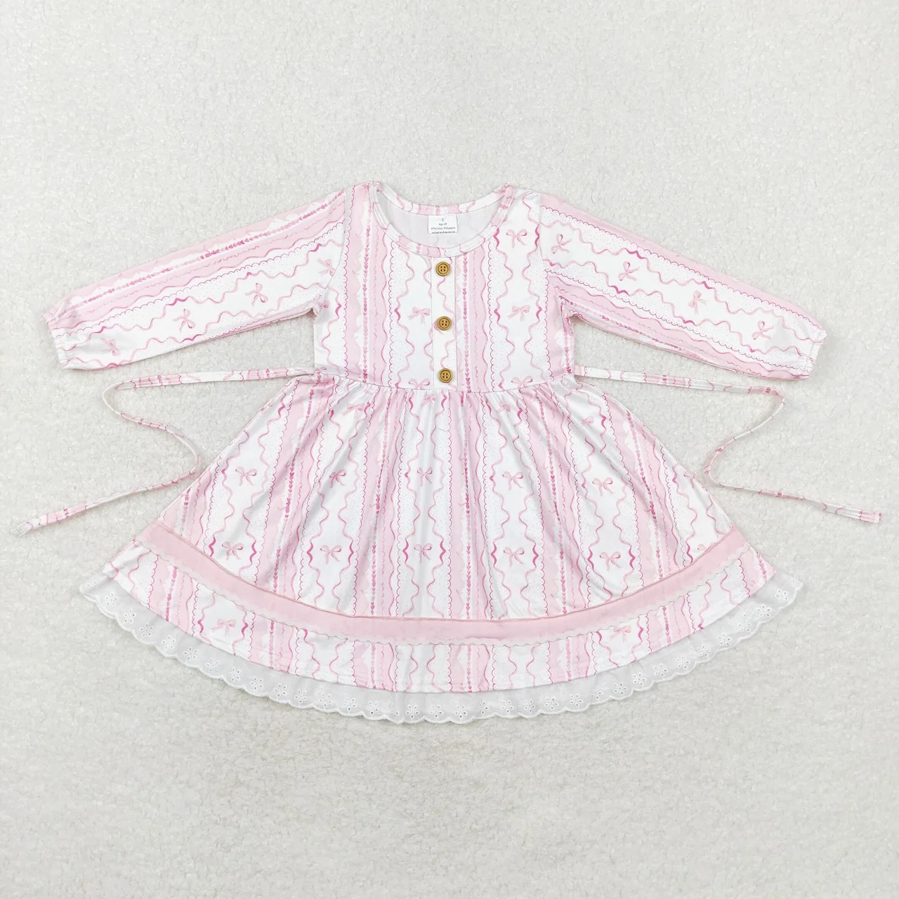 Детское платье с длинным рукавом розовое бантом длиной до колена оборками на