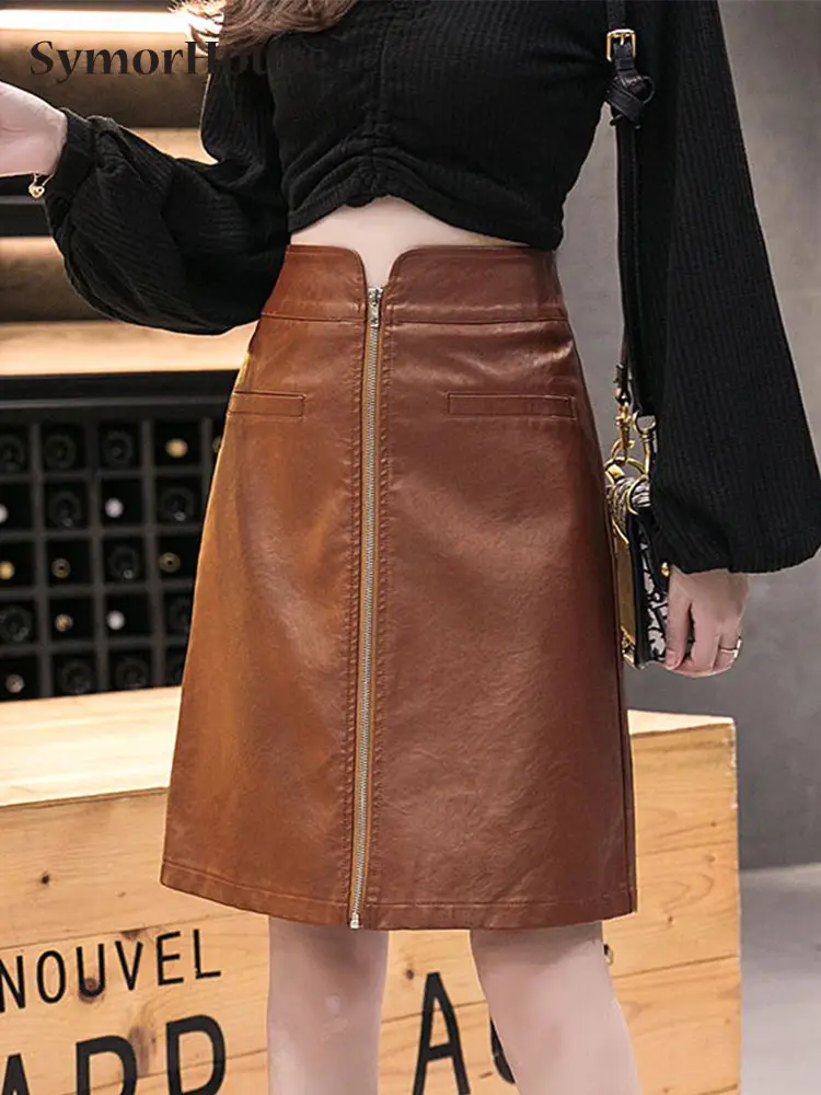 

Осень-зима 2023, новая юбка из искусственной кожи на молнии, Женская Корейская черная шикарная привлекательная мини-юбка трапециевидной формы с высокой талией и запахом на бедрах, Женская