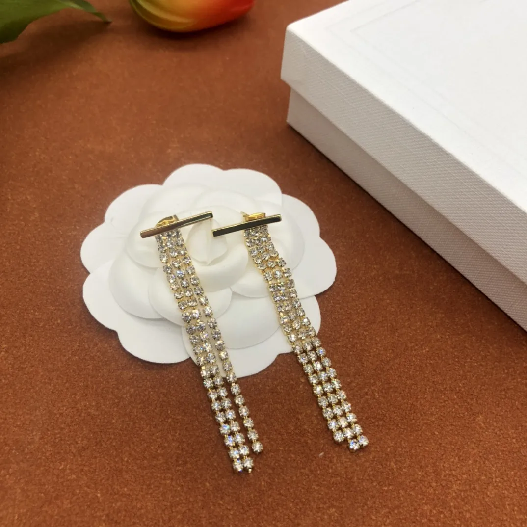 

European and American popular new inlaid tassel earrings