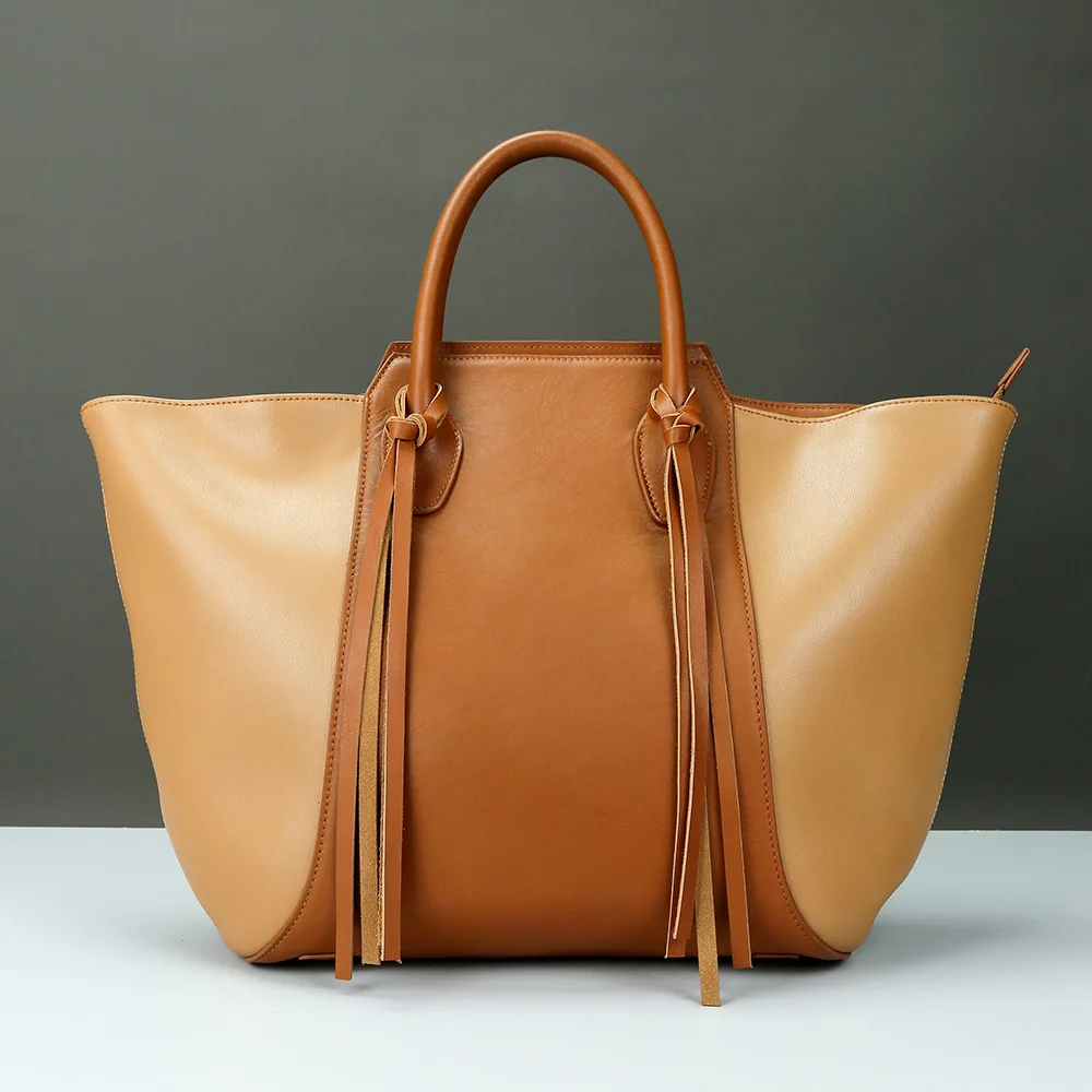 

Сумка женская кожаная с контрастной кисточкой, вместительный саквояж со сращением, дизайнерская простая сумочка-тоут