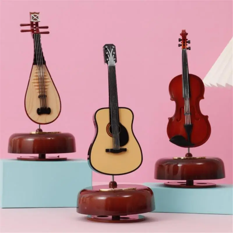 

Creative Guitar Violin Music Box Rotary Plastic Music Box Birthday Gift Children's Holiday Toys Gift Living Room Decoration