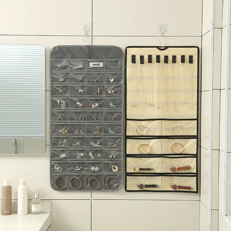 

Организуйте свою коллекцию ювелирных изделий с помощью двусторонней сумочки для хранения ювелирных изделий с 80 отделениями
