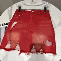 2022 summer new classic style hollowed heart shape ripped washed white denim package hip skirt for women red denimwear