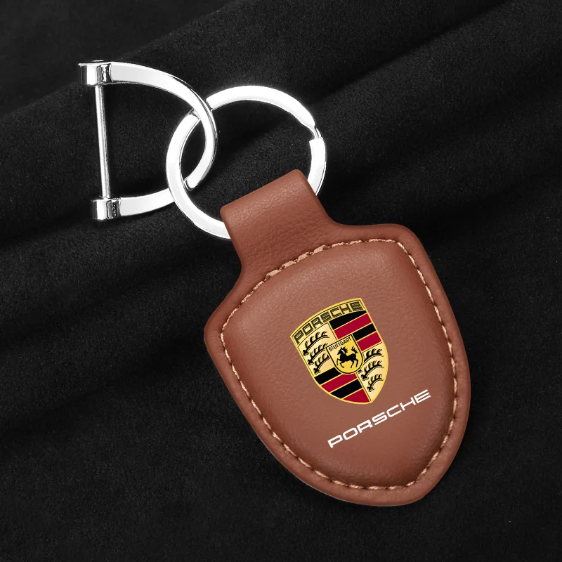 Фото Кожаный автомобильный брелок для ключей с щитком для Porsche Panamera Cayenne Taycan 911 718 Macan Carrera-GT 928 944 968 944 аксессуар №1