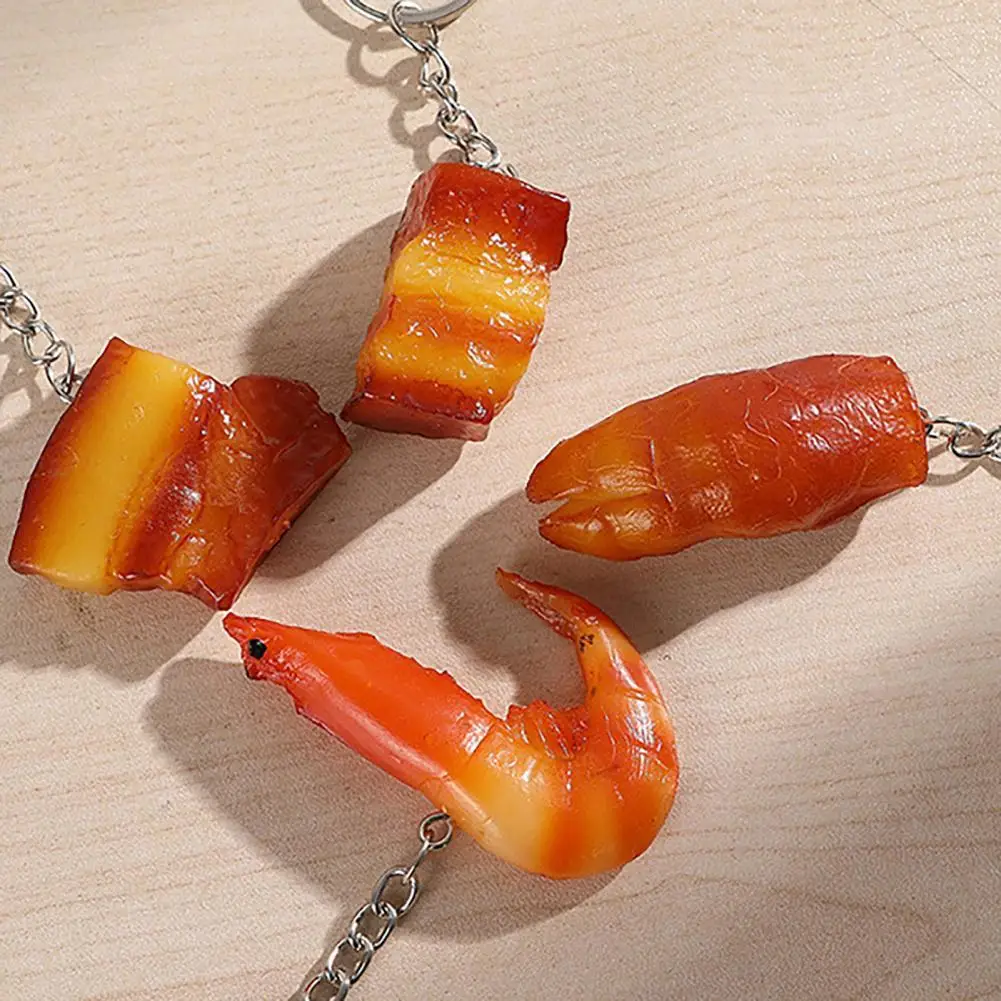 

Декоративная подвеска для телефона в виде мультяшной свиньи ног жареной утки