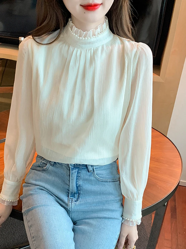 

Блузка женская с воротником-стойкой, длинным рукавом-фонариком и жемчужинами