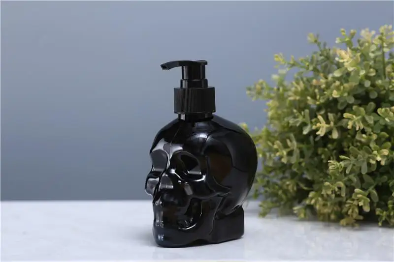 

Cool black skull head hand sanitizer bottle, plastic universal small sub packaging bottle, toilet press type lotion bottle