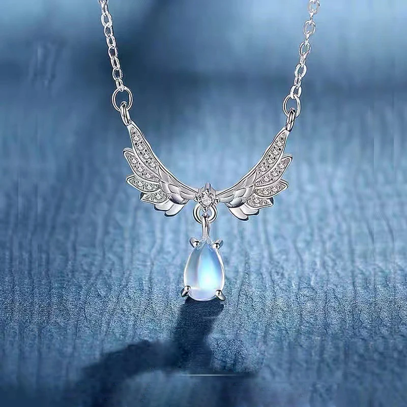 

New Hot Selling Silver Color Personality Angel Wings Moonstone Pendant Fashion Women Necklace Gift XL-069