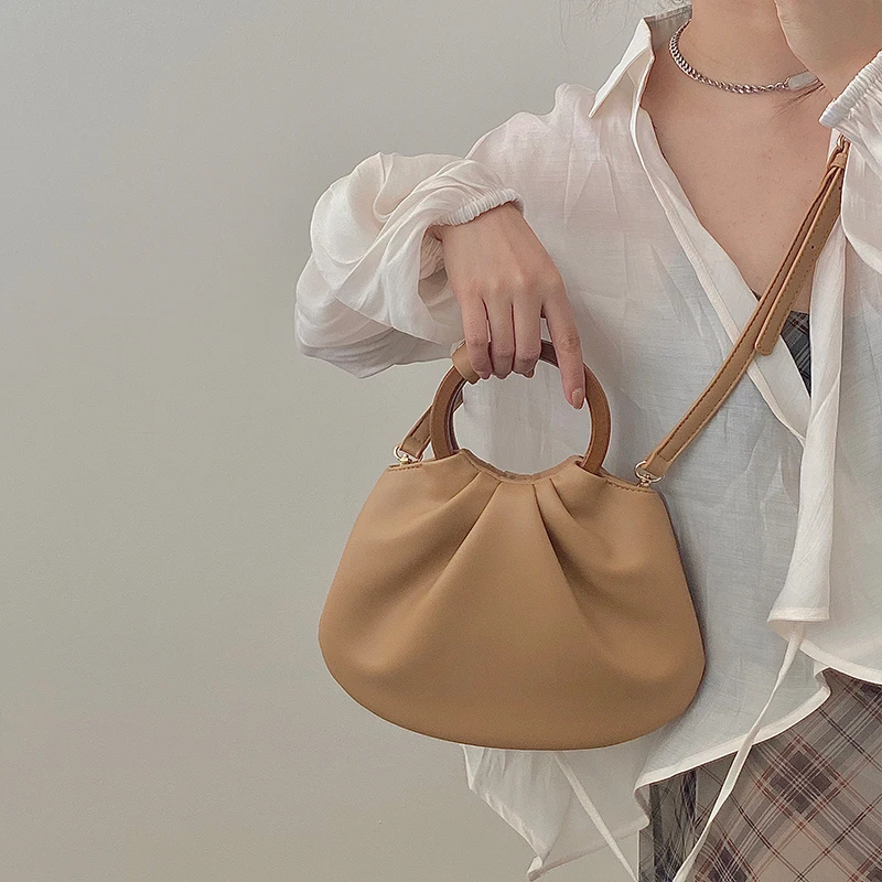 

Korean minority design retro wooden handle portable women's bag single shoulder diagonal span temperament wrinkled bag