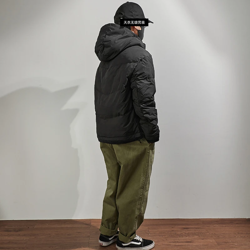 Hooded down jacket men's fake two pieces of loose shoulder sleeves in winter, the new warm outer wear black stitching jacket.