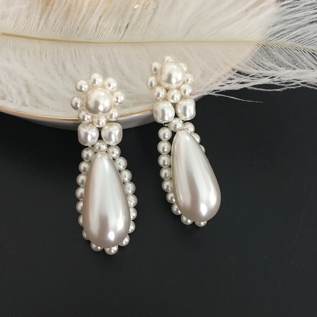 

Hand Braided Pearl Sterling Silver Stud Earrings Catwalk Elegance Pearl Floral Earrings